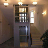 Hydraulic home lift with automatic doors